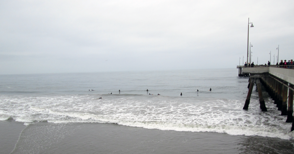Venice Pier and the surfers on an overcast day