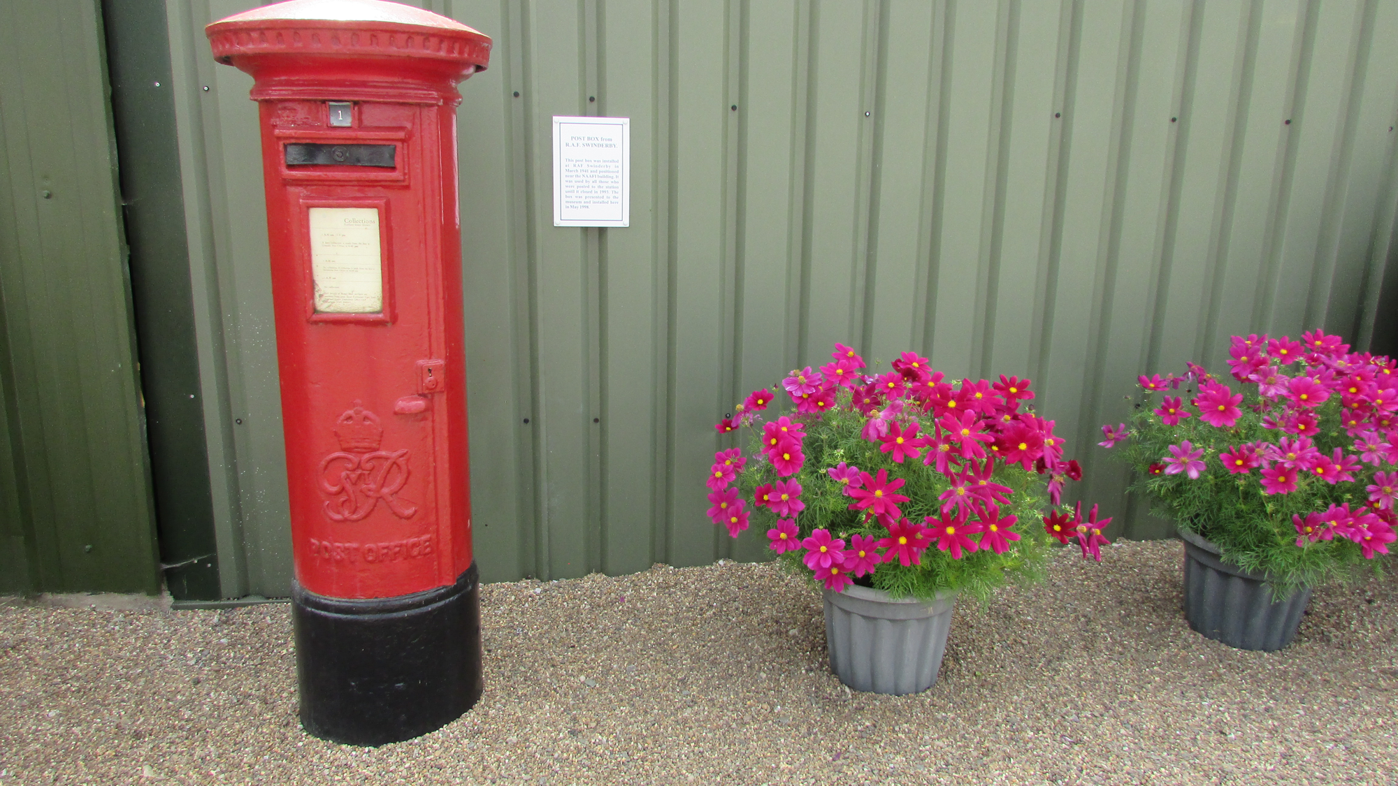Royal Post box and flowers at the Newark Air Museum.