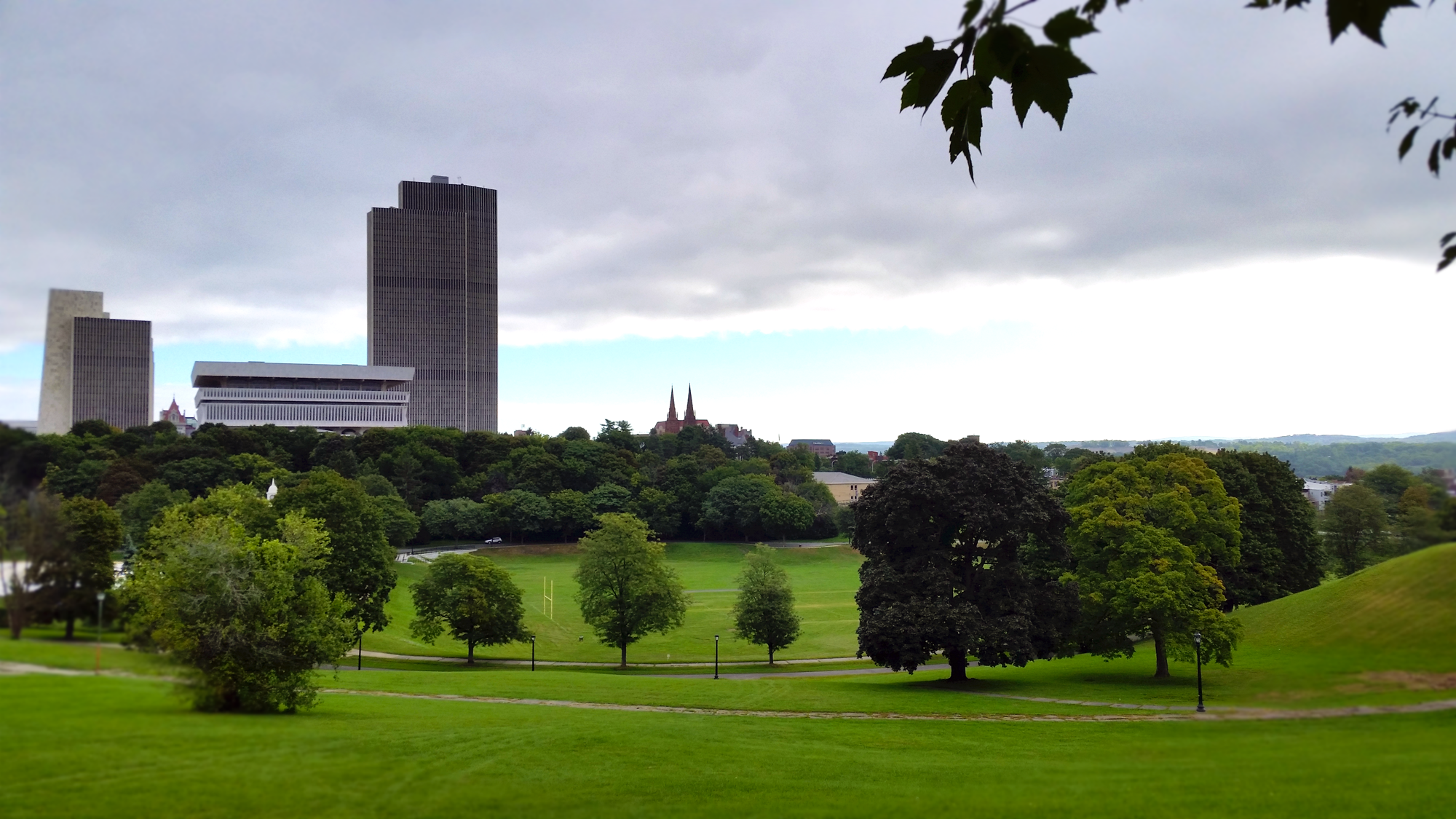 Downtown Albany as viewed over Lincoln Park featuring the Corning Tower, State Museum, and the spires of Cathedral of the Immaculate Conception.