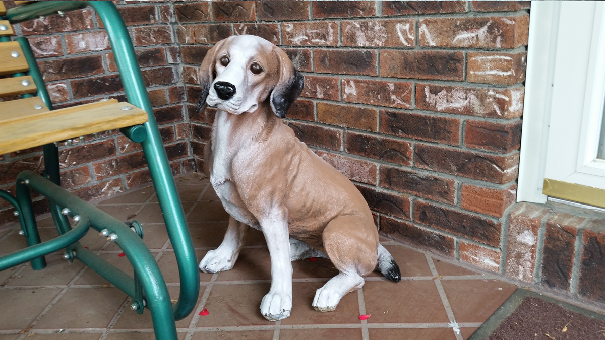 A second plastic dog statue